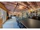 Large unfinished basement featuring a ping pong table and ample storage, perfect for customization at 1775 Rockwater Rd, Marietta, GA 30066