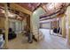 Unfinished basement featuring framed walls, exposed ceiling, and a staircase leading to potential living space at 1775 Rockwater Rd, Marietta, GA 30066