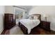 Cozy bedroom with hardwood floors, a large window, and matching nightstands and dresser at 1775 Rockwater Rd, Marietta, GA 30066