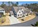 Beautifully designed home features a large driveway, three-car garage and a meticulously maintained lawn at 1775 Rockwater Rd, Marietta, GA 30066