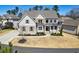 Charming two-story home with brick and stone accents, complemented by a well-manicured lawn at 1775 Rockwater Rd, Marietta, GA 30066