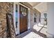 Welcoming front entrance with a hello doormat and charming brickwork, creating a warm invitation at 1775 Rockwater Rd, Marietta, GA 30066