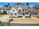 Charming two-story home featuring brick and siding exterior, well-manicured landscaping, and inviting front porch at 1775 Rockwater Rd, Marietta, GA 30066