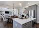 Bright, open kitchen with a center island, stainless steel appliances, and a view to the living room at 1775 Rockwater Rd, Marietta, GA 30066