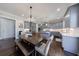 Spacious kitchen and dining area with gray cabinets, hardwood floors, and modern lighting at 1775 Rockwater Rd, Marietta, GA 30066