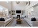 Bright living room with soaring ceilings, large windows, fireplace, and an open floorplan at 1775 Rockwater Rd, Marietta, GA 30066