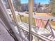 Balcony view showing a neighborhood street with houses, trees, and a table and chairs on the balcony at 2270 Goodwood Se Blvd, Smyrna, GA 30080