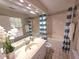 Bright bathroom with a tub, shower, modern commode and vanity, plus a large window for natural light at 2270 Goodwood Se Blvd, Smyrna, GA 30080