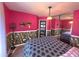 Stylish bedroom with floral wallpaper, an area rug, and a mirrored closet reflecting the room at 2270 Goodwood Se Blvd, Smyrna, GA 30080