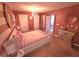 Cozy bedroom featuring carpeted floors, a modern chandelier, and a large decorative mirror at 2270 Goodwood Se Blvd, Smyrna, GA 30080