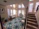 Inviting entryway featuring high ceilings, lots of windows, and stylish decor, plus stairs to upper level at 2270 Goodwood Se Blvd, Smyrna, GA 30080