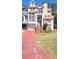 Multi-level home with driveway, attached garage, and manicured lawn; part of a residential community at 2270 Goodwood Se Blvd, Smyrna, GA 30080