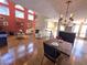 Elegant living and dining area featuring hardwood floors, tall windows, and designer furnishings at 2270 Goodwood Se Blvd, Smyrna, GA 30080