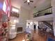 Open-concept living room featuring a fireplace, hardwood floors, and a staircase at 2270 Goodwood Se Blvd, Smyrna, GA 30080