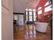 Bright living room with high ceilings, tall windows, hardwood floors, and stylish furnishings at 2270 Goodwood Se Blvd, Smyrna, GA 30080