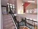 Carpeted staircase ascending to an open floor plan with views of the living room and dining area at 2270 Goodwood Se Blvd, Smyrna, GA 30080