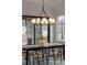 Cozy dining room with chandelier and views of outdoor living space at 56 Pine St, Roswell, GA 30075