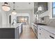 Bright kitchen with stainless steel appliances, island and marble countertops at 56 Pine St, Roswell, GA 30075