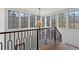Bright staircase with modern railing and a view of the outdoors at 56 Pine St, Roswell, GA 30075