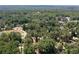 Wide aerial view showcasing a neighborhood filled with lush trees, mature landscaping, and serene residential streets at 59 Woodlawn Dr, Marietta, GA 30067
