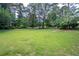 Expansive backyard featuring a lush green lawn, perfect for outdoor activities at 59 Woodlawn Dr, Marietta, GA 30067