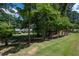 Well-manicured front lawn and landscaping leading up to a quaint home at 59 Woodlawn Dr, Marietta, GA 30067