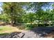 Well-maintained property with mature trees, lush lawn, and inviting curb appeal at 59 Woodlawn Dr, Marietta, GA 30067