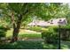 Charming home with manicured front yard, lush landscaping, and a welcoming ambiance at 59 Woodlawn Dr, Marietta, GA 30067