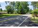 View of a neighborhood street with mature trees and well maintained properties at 59 Woodlawn Dr, Marietta, GA 30067