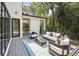 Inviting back deck with comfortable seating area, modern design, and a view of lush greenery at 159 E Wesley Ne Rd, Atlanta, GA 30305