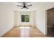 Bright bedroom with hardwood floors, large window, and minimalist modern design at 159 E Wesley Ne Rd, Atlanta, GA 30305