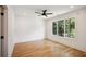 Bright, minimalist bedroom with hardwood floors, recessed lighting and large window at 159 E Wesley Ne Rd, Atlanta, GA 30305