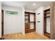 Spacious walk-in closet featuring custom shelving, drawers and ample storage space at 159 E Wesley Ne Rd, Atlanta, GA 30305