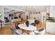 Open-concept kitchen and dining area with modern furnishings and hardwood floors at 159 E Wesley Ne Rd, Atlanta, GA 30305