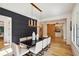 Dining room with a modern gold light fixture and dark accent wall at 159 E Wesley Ne Rd, Atlanta, GA 30305
