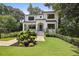 Beautifully landscaped front yard of a two-story home with a stone walkway at 159 E Wesley Ne Rd, Atlanta, GA 30305