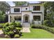 Charming two-story brick home with manicured lawn and inviting front entrance at 159 E Wesley Ne Rd, Atlanta, GA 30305