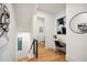Hallway with stairs, art, desk, and an adjacent bathroom at 159 E Wesley Ne Rd, Atlanta, GA 30305