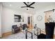 Home office with glass desk, comfortable seating, and modern decor at 159 E Wesley Ne Rd, Atlanta, GA 30305