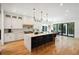 Spacious kitchen with sleek white cabinets, a large island, and bar stool seating at 159 E Wesley Ne Rd, Atlanta, GA 30305
