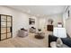 Cozy living room featuring neutral tones, area rug, recessed lighting, and modern black framed glass door at 159 E Wesley Ne Rd, Atlanta, GA 30305
