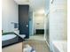 Bright bathroom with tiled shower, updated fixtures, walk-in closet, and modern vanity at 5300 Peachtree Rd # 503, Atlanta, GA 30341