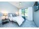 Comfortable bedroom featuring a plush carpet, large window, and stylish modern decor at 5300 Peachtree Rd # 503, Atlanta, GA 30341