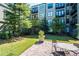Beautifully maintained courtyard with manicured lawn, brick patio, and community seating areas at 5300 Peachtree Rd # 503, Atlanta, GA 30341