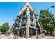 Modern building exterior with balconies and street-level retail space at 5300 Peachtree Rd # 503, Atlanta, GA 30341