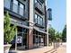 The Lofts at 5300, showcasing modern architecture, balconies, and storefront windows near a tree-lined street at 5300 Peachtree Rd # 503, Atlanta, GA 30341