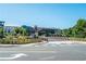 A modern building complex surrounded by trees and landscaping is viewed from a bridge on a sunny day at 5300 Peachtree Rd # 503, Atlanta, GA 30341