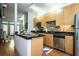 Well-equipped kitchen with stainless steel appliances and a breakfast bar at 5300 Peachtree Rd # 503, Atlanta, GA 30341