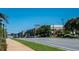 A sunny day street view with CHAMBLEE sign and building in background and tree-lined median in foreground at 5300 Peachtree Rd # 503, Atlanta, GA 30341