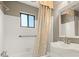 Bright bathroom featuring a shower/tub, window, and classic fixtures at 6 Westchester Sq, Decatur, GA 30030